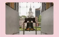 The Liberty Bell, a bronze cracked bell from the 1700s, is displayed in a museum in front of Independence Hall in Philadelphia.