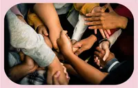Many hands shaking other hands.