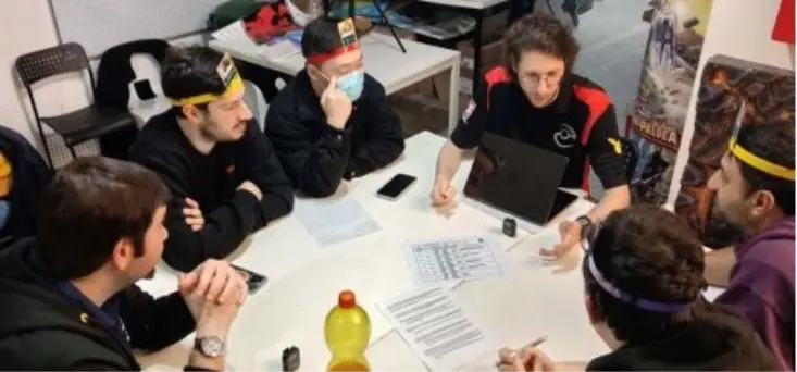 A
  group
  of
  people
  sitting
  around
  a
  table
  AI-generated
  content
  may
  be
  incorrect.