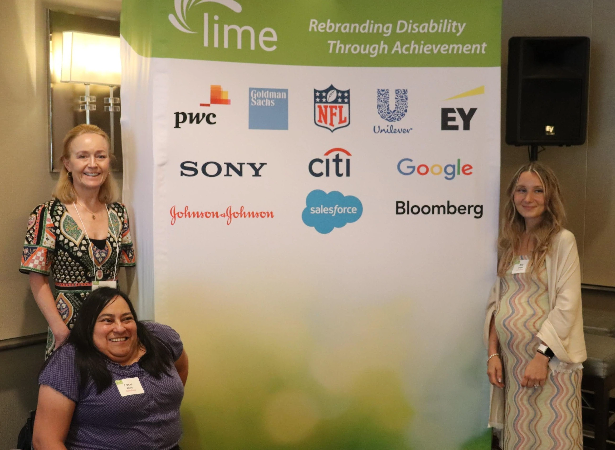 Salesforce representatives and Susan Lang, Lime Connect CEO pose in front of banner with company logos, including Salesforce.