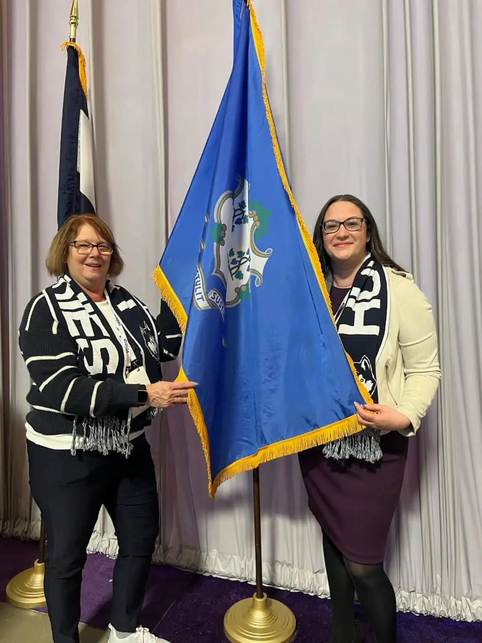 Karen Viets and Melissa Robinson with Connecticut Flag